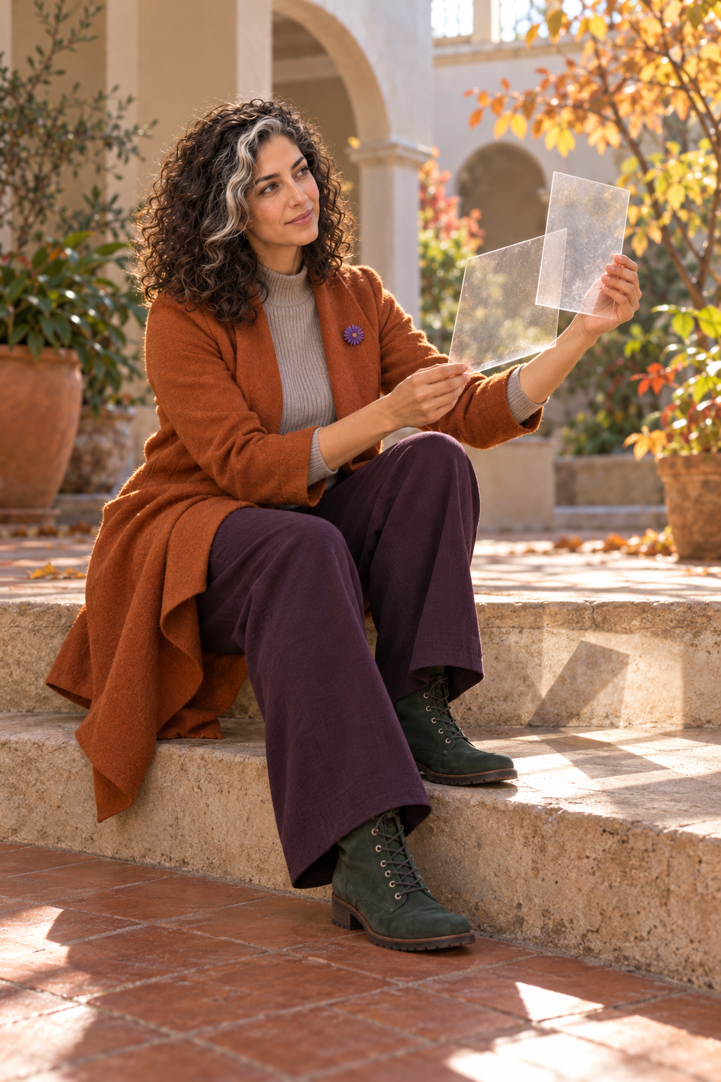 Imaginative scene of Aster Averi seated in an autumn courtyard and turning two blank translucent panels into overlapping light